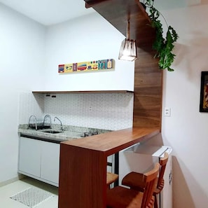 Fridge, microwave, stovetop, coffee/tea maker