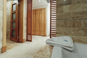 Shower, hair dryer, towels, soap