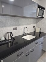 Full-sized fridge, microwave, espresso maker, coffee/tea maker