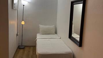 Family Apartment | Desk, laptop workspace, blackout drapes, iron/ironing board