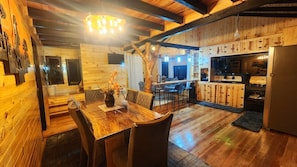Romantic Cabin, Jetted Tub, Mountain View | Private kitchen | Fridge, cookware/dishes/utensils, dining tables