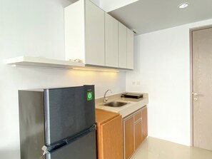 Standard Apartment | Private kitchen - Comfort Stay Studio At Vasanta Innopark Apartment (Cikarang)