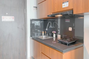 Standard Apartment | Private kitchen | Cookware/dishes/utensils - Strategic And Homey Studio At Lrt City Bekasi Apartment (Bekasi)