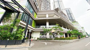 A modern building with a prominent sign for the Marketing Gallery on Eastern Green Avenue. - Strategic And Homey Studio At Lrt City Bekasi Apartment (Bekasi)
