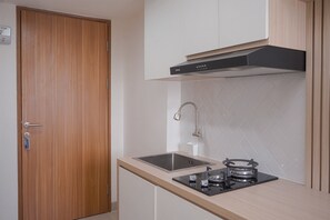 Standard Apartment | Private kitchen | Cookware/dishes/utensils - Minimalist And Warm Studio Room At Cisauk Point Apartment (Cisauk)