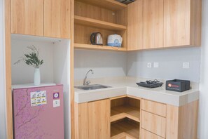 Apartamento standard | Cozinha privada | Geladeira, cooktop, talheres/pratos/utensílios de cozinha