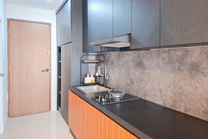 Standard Apartment | Private kitchen | Cookware/dishes/utensils - Minimalist Studio Apartment At Sudimara Forestwalk (South Tangerang)