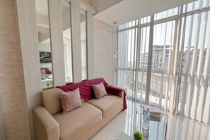 Standard Apartment | Living area - Modern Minimalist 2Br At Linden Apartment (Surabaya)