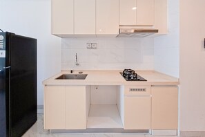 Apartamento standard | Cozinha privada | Talheres/pratos/utensílios de cozinha