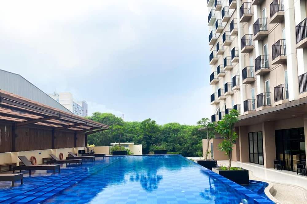 Simple 2Br At Azalea Suites Apartment