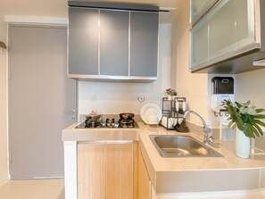 Standard Apartment | Private kitchen | Cookware/dishes/utensils - Woodlight 2Br At Vasanta Innopark Apartment (Cikarang)