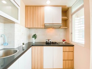 Private kitchen - Simple And Homey 2Br At Grand Kamala Lagoon Apartment (Bekasi)