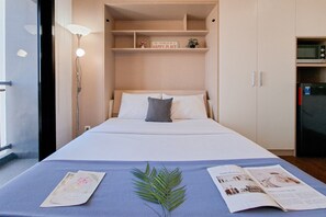 Deluxe Apartment | Iron/ironing board - Cozy Studio Apartment At The Ayoma (South Tangerang)