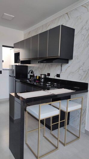 Fridge, stovetop, coffee/tea maker, cookware/dishes/utensils