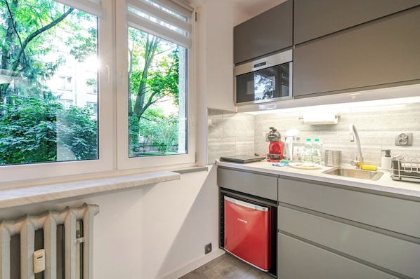 Fridge, microwave, stovetop, coffee/tea maker