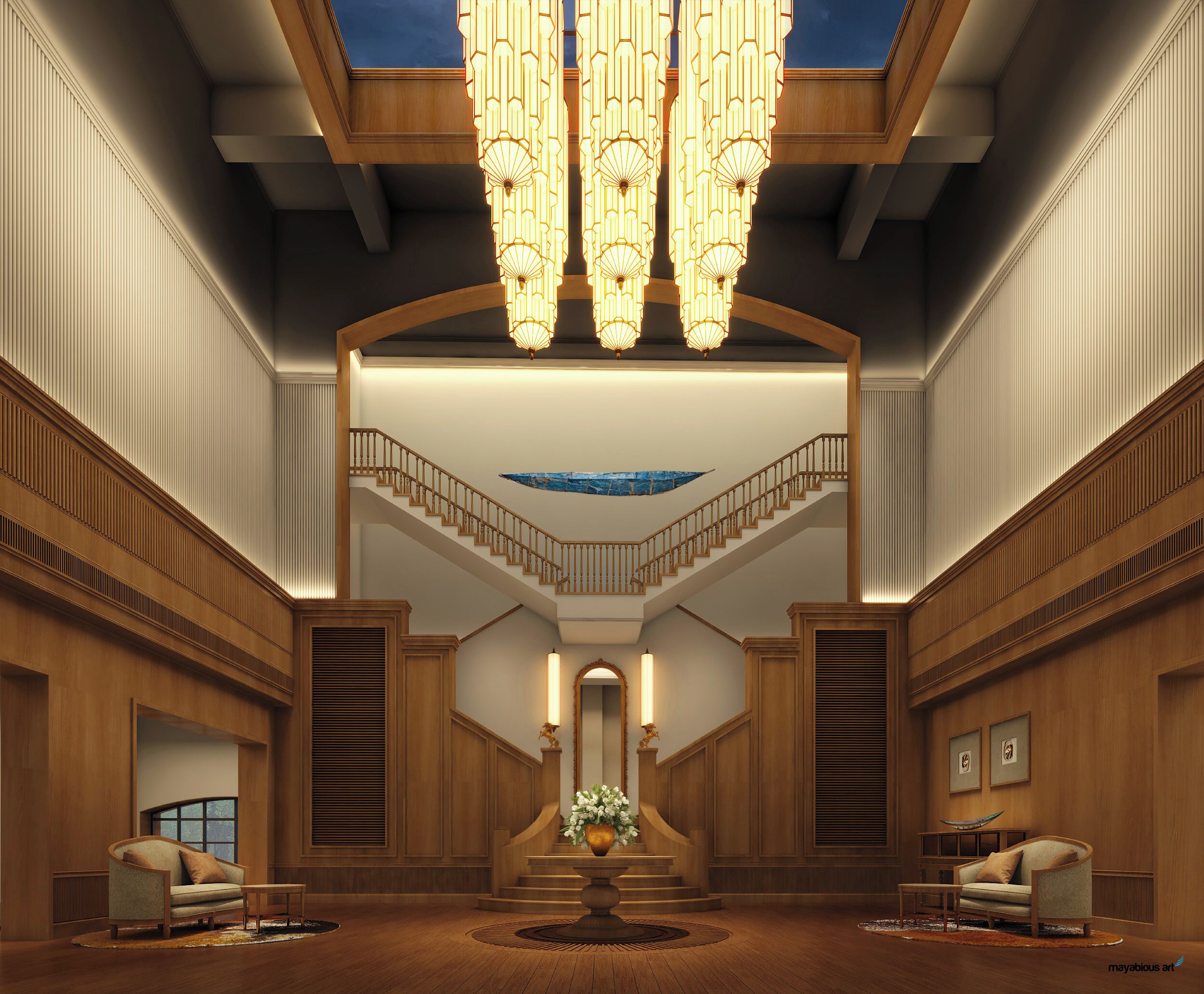 A grand lobby with a high ceiling, a central staircase, and a chandelier.