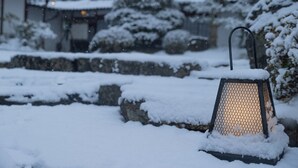 A lantern in a snowy outdoor setting. - Ryori Ryokan Yamazato Ryori Isobe (Nantan)