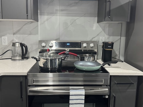 Modern comfort just 15 minutes from the airport, with a full kitchen.