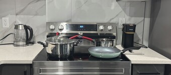 Modern comfort just 15 minutes from the airport, with a full kitchen.