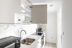 Fridge, microwave, oven, cookware/dishes/utensils