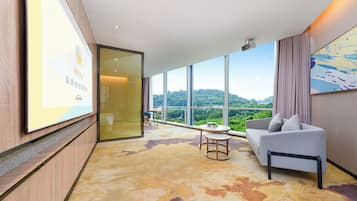 Family Suite, City View | Desk, laptop workspace, blackout drapes, iron/ironing board