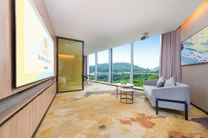 Family Suite, City View | Desk, laptop workspace, blackout drapes, iron/ironing board