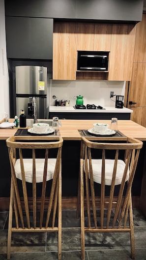 Fridge, microwave, stovetop, coffee/tea maker