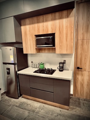 Fridge, microwave, stovetop, coffee/tea maker