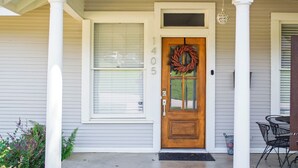 A house with a front door, a window, and a porch. - Immaculately restored home in Downtown Brenham (Brenham)