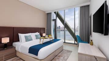 Deluxe Apartment, Sea View | In-room safe, blackout drapes, iron/ironing board, free WiFi