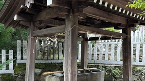 A traditional wooden pavilion with a stone base, surrounded by stone lanterns and a stone fence with inscriptions. - Full-rental, ideal for short- to medium-term stays for sightseeing, business trips, study abroad, etc./Apartment in Amakubo, Tsukuba City (Tsukuba City Amakubo 4chome)