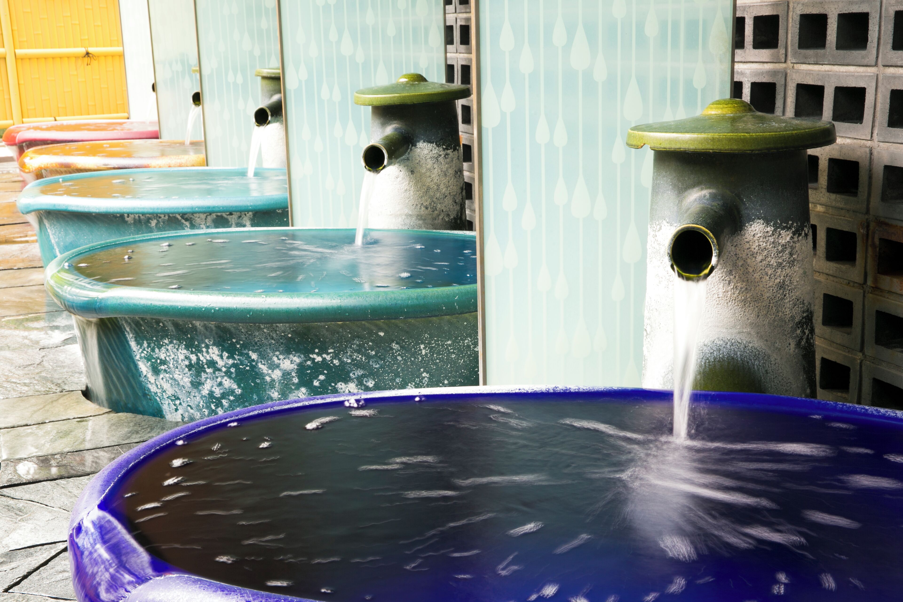 A series of outdoor water features with multiple fountains.
