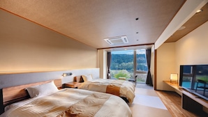 A modern hotel room with two beds, a large window with a view of the outdoors, and a flat-screen TV. - Jinzukyo Kasuga Onsen Tominowa (Toyama)