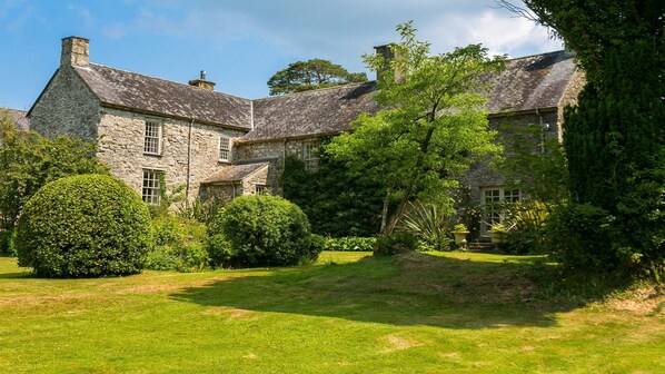 A stone building with multiple windows and a well-maintained lawn. - Ty Fry Estate - sleeps 16 guests  in 8 bedrooms (Pentraeth/Red Wharf Bay)
