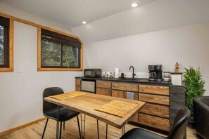 Microwave, coffee/tea maker, cookware/dishes/utensils, dining tables