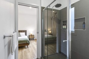 Shower, hair dryer, towels, shampoo