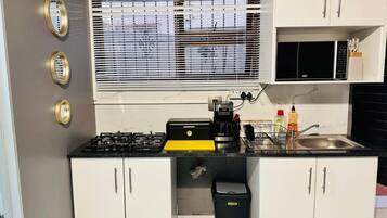 Fridge, microwave, stovetop, coffee/tea maker