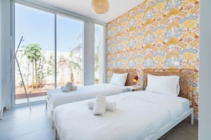 Garden view - 2BR Apartment (C0-1) | Premium bedding, individually decorated, individually furnished