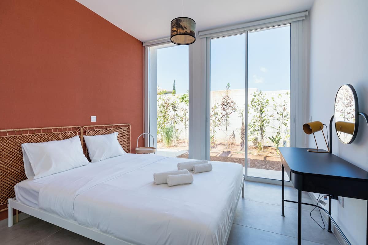 Garden view - 2BR Apartment (C0-1) | Premium bedding, individually decorated, individually furnished