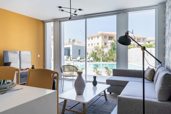 Pool view - 2BR Apartment (D0-2) | Living room