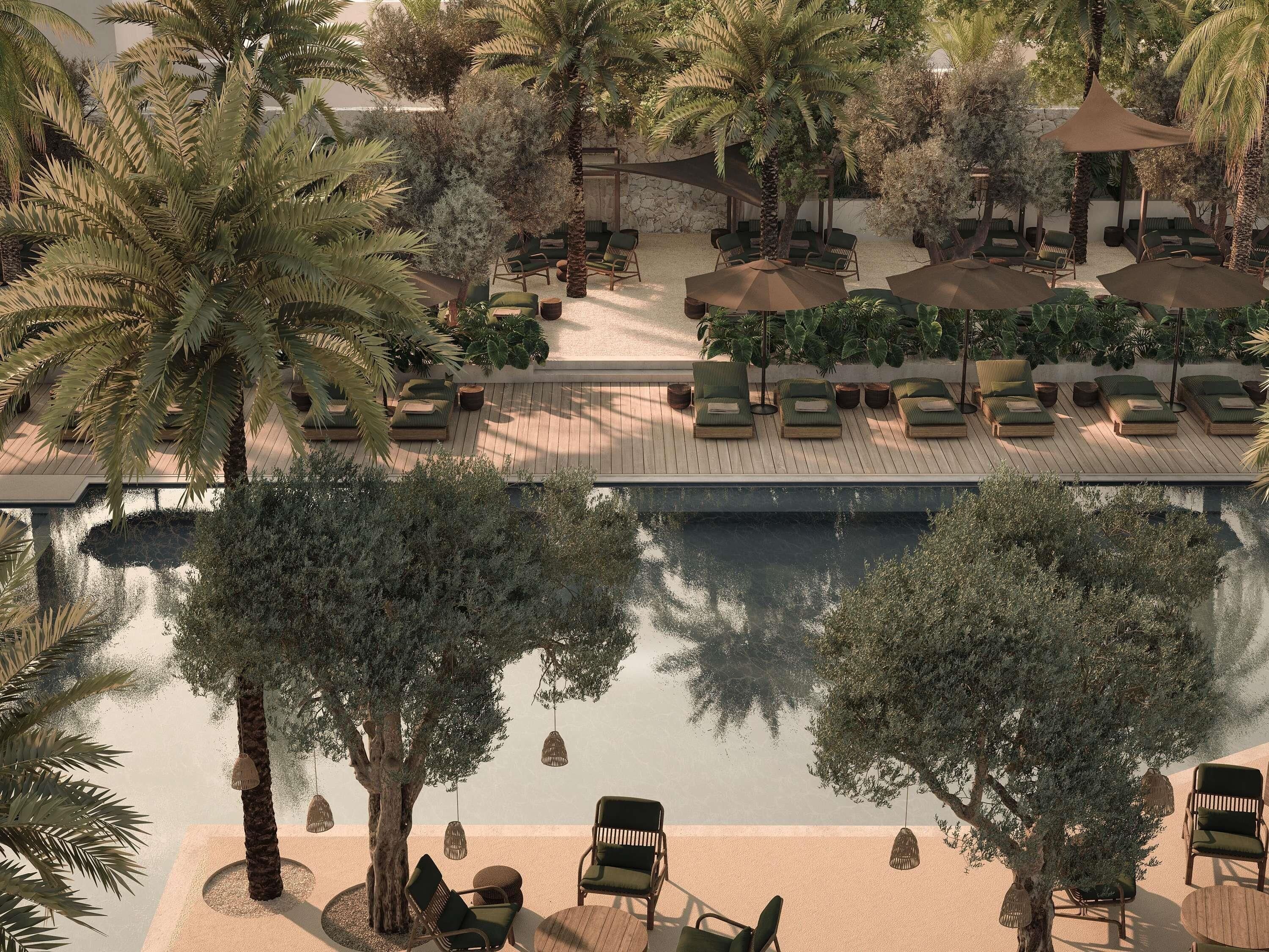Un espace aménagé au bord de la piscine, avec des chaises longues, des parasols et une vue sur l’eau.