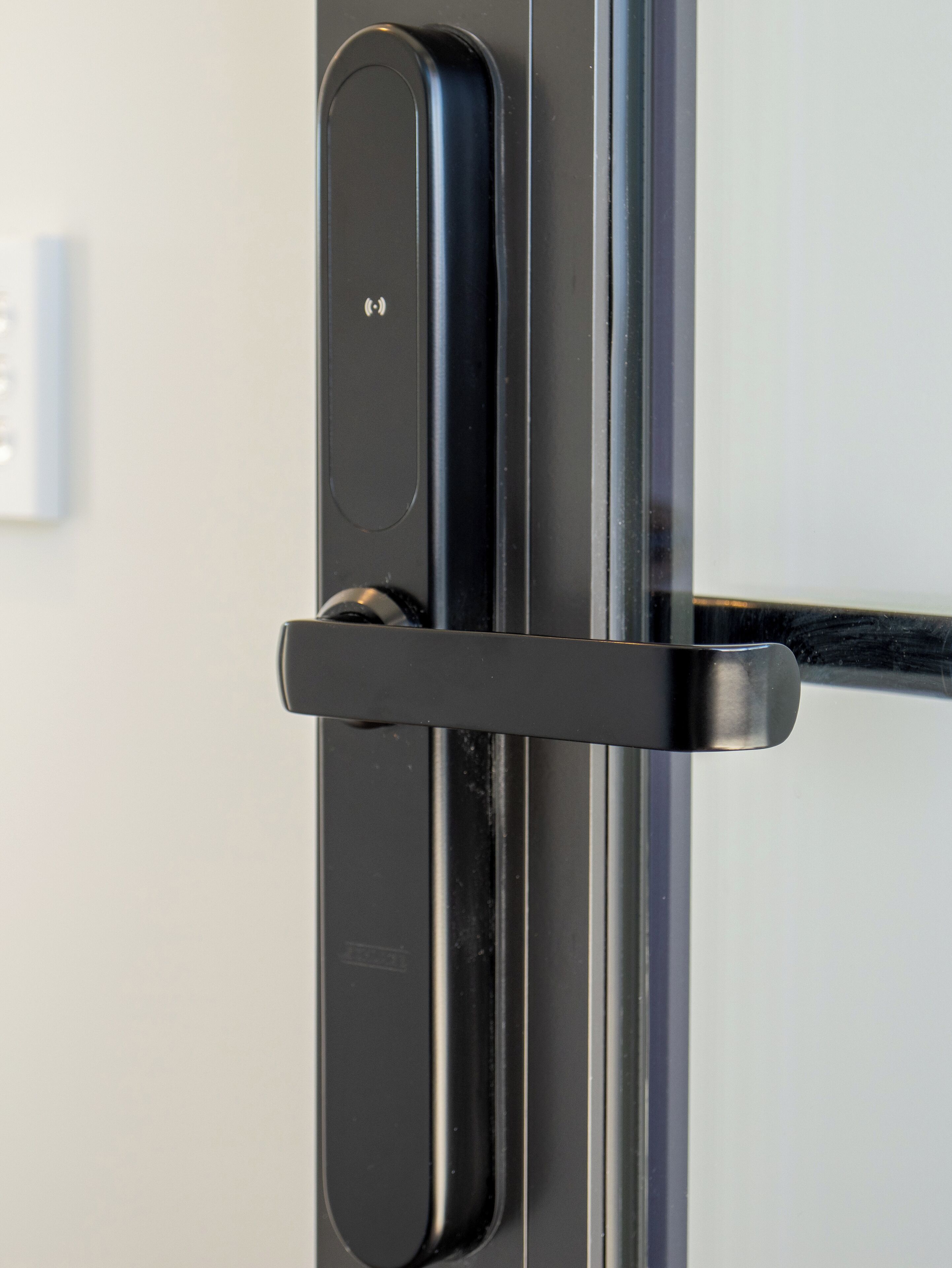 A close-up of a door handle and lock mechanism.