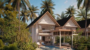 A two-story resort with a pool, surrounded by lush tropical vegetation and palm trees. - Meyyafushi Maldives - Premium All Inclusive (Meyyafushi)