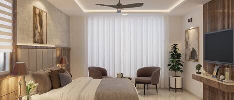 A modern bedroom with a large bed, two chairs, a TV, and a ceiling fan.