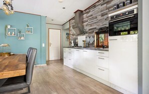 Fridge, stovetop, dishwasher, coffee/tea maker