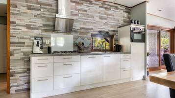 Fridge, stovetop, dishwasher, coffee/tea maker