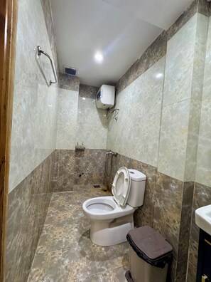 Shower, hair dryer, slippers, towels
