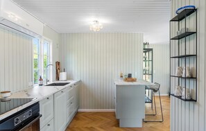 Fridge, stovetop, dishwasher, coffee/tea maker