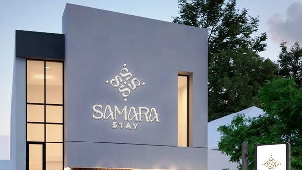 A modern building with a sign reading "Samara Stay". - Samara Stay by Sinergi (Semarang)