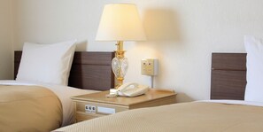 غرفة ديلوكس بسريرين منفصلين - منظر للحديقة | ستائر تعتيم ومكواة/لوح كي وواي فاي مجانًا